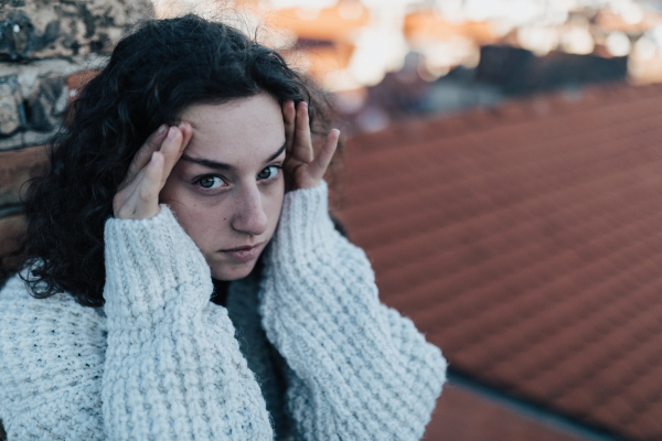 A portrait of unhappy young woman in depression life period.