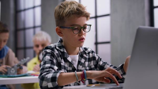 School kids using computer in a classroom at school