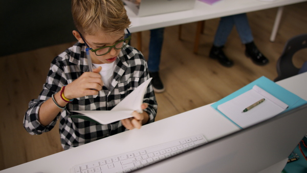 School kids using computer in a classroom at school