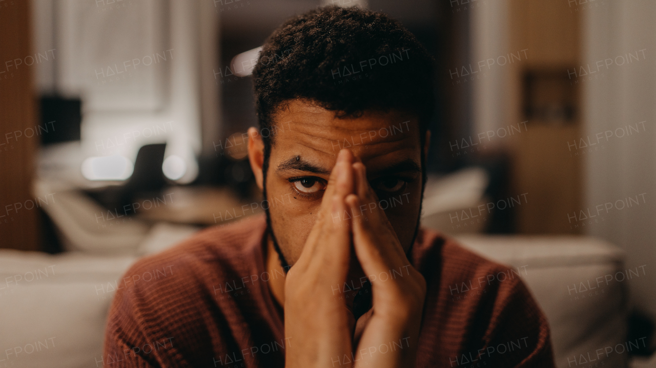 A portrait od sad young African - American man.