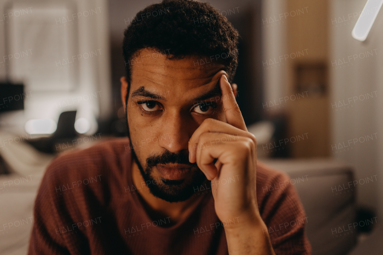 A portrait od sad young African - American man.