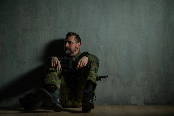 A frustrated military soldier sitting in boot camp