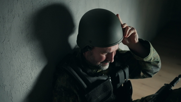 A frustrated military soldier sitting in boot camp