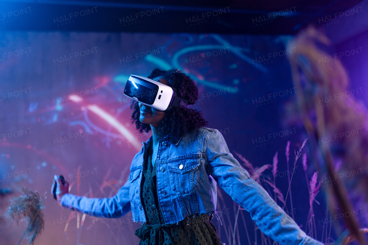 Metaverse digital cyber world technology, girl with virtual reality VR goggles playing augmented reality game, futuristic lifestyle