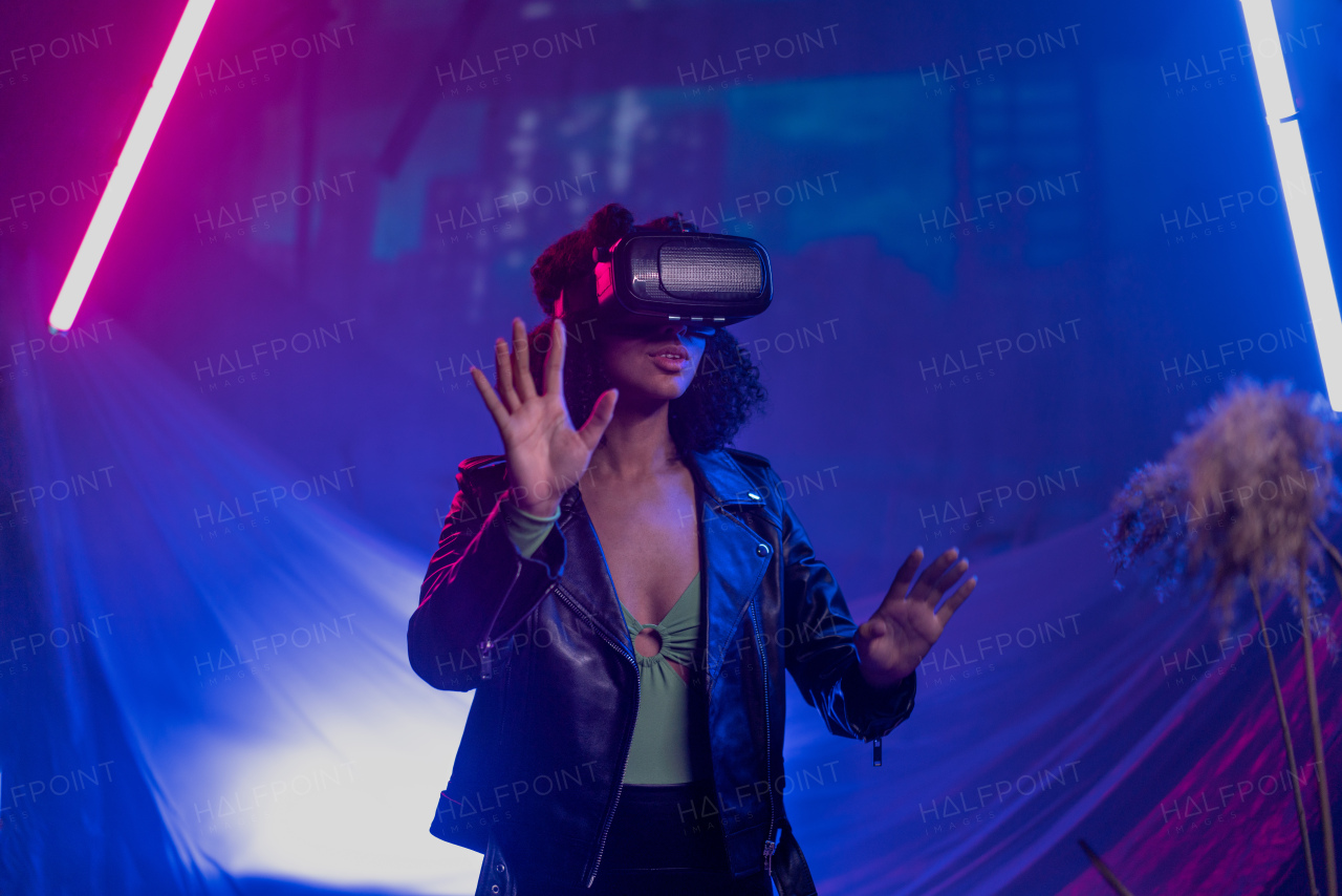 Metaverse digital cyber world technology, a woman with virtual reality VR goggles playing augmented reality game, futuristic lifestyle