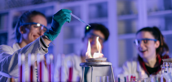 A science student doing chemical experiment in the laboratory at university.