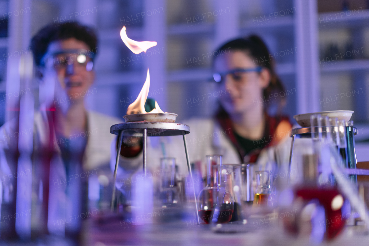 A science student doing chemical experiment in the laboratory at university.