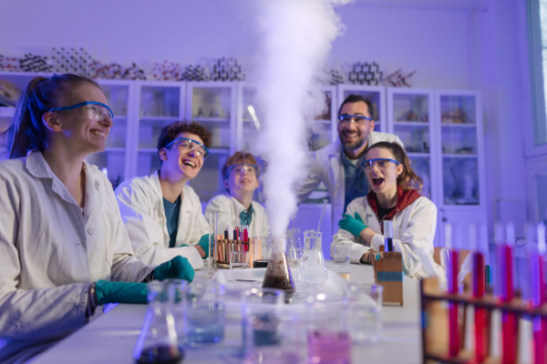 Science students doing a chemical experiment in the laboratory at university.