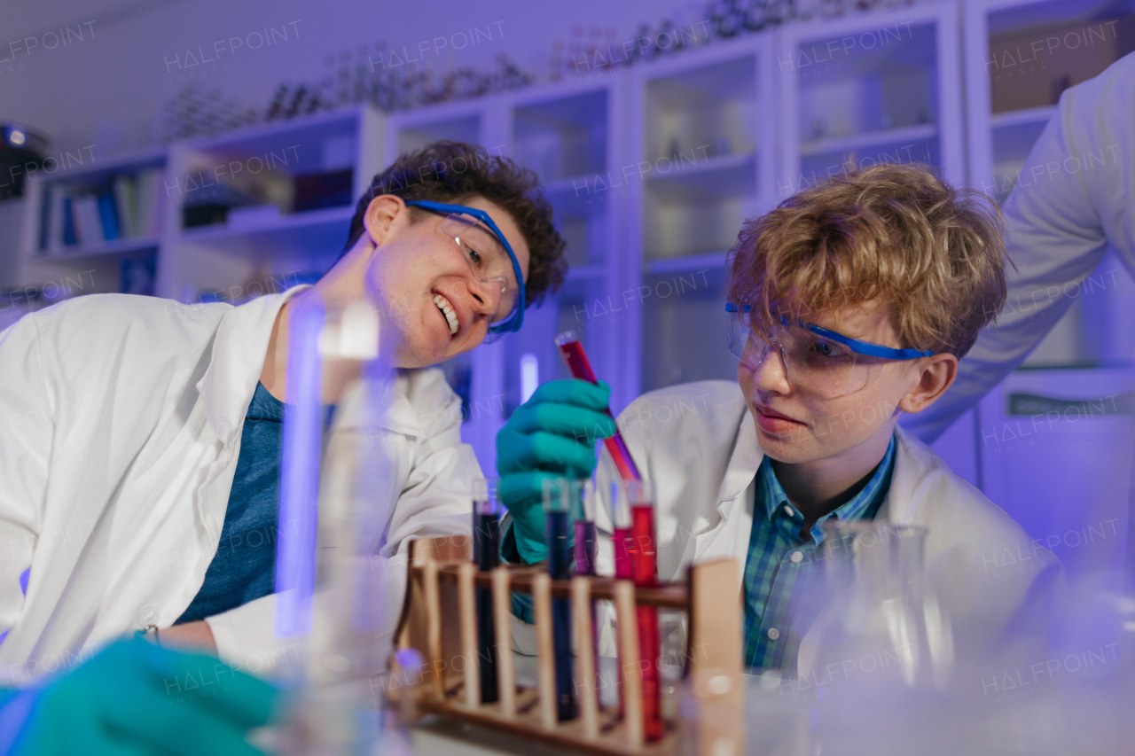 A science student doing chemical experiment in the laboratory at university.