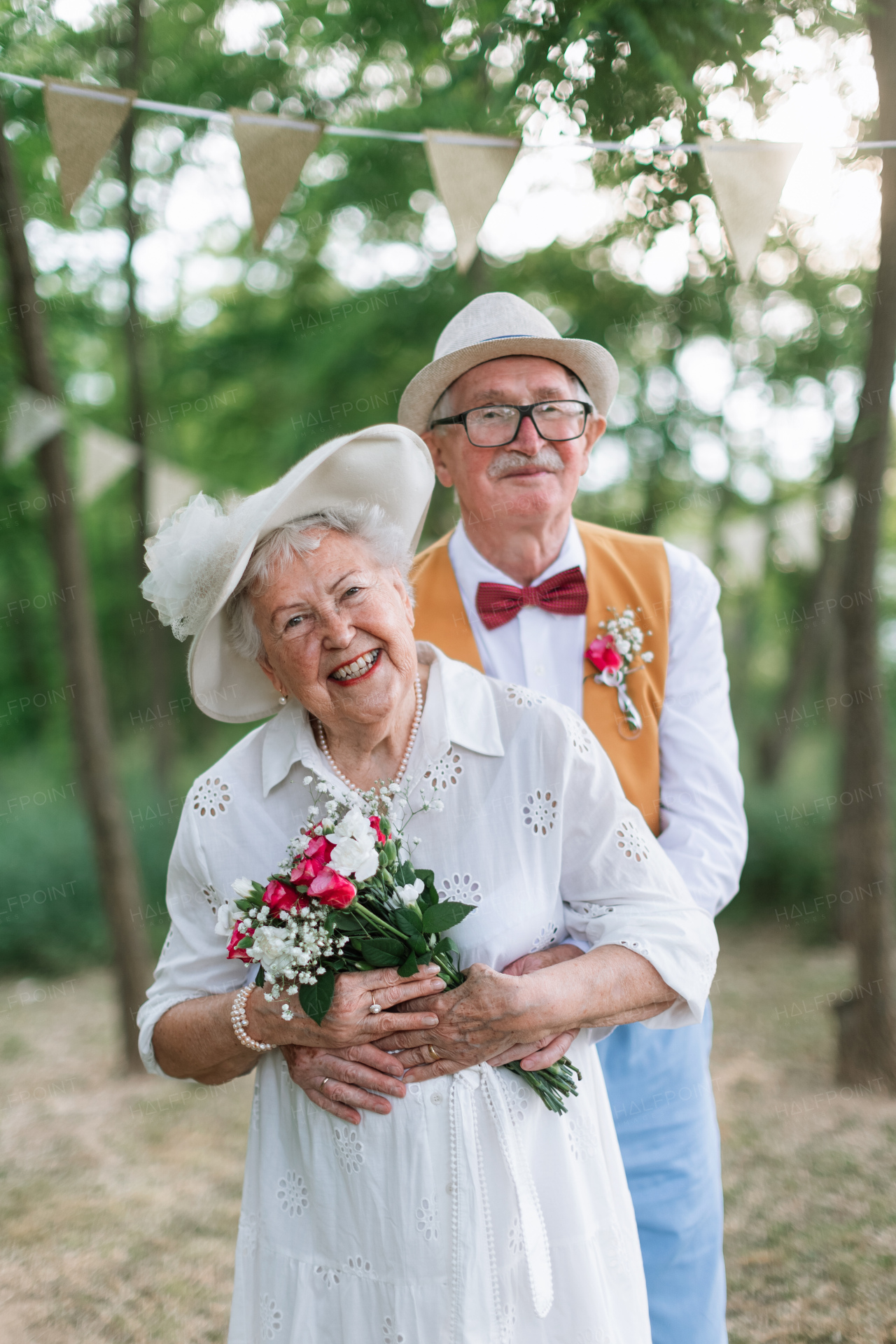 Senior couple having marriage in nature during a summer day.