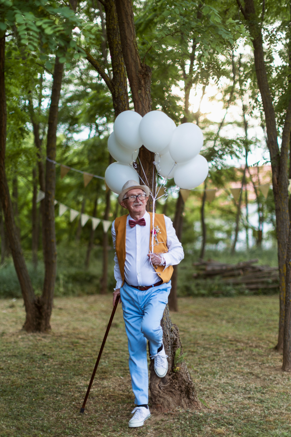 Portrait of senior man having wedding in the nature.