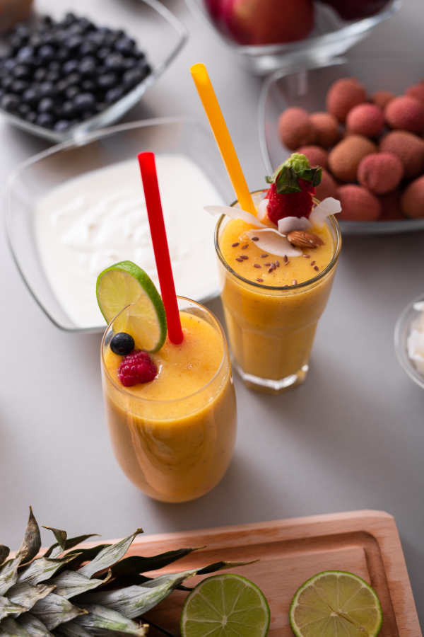 A fresh homemade fruit smoothie, healthy juicy vitamin drink diet or vegan food concept