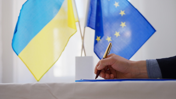 Signing a document between European Union and Ukraine, Ukraine joining Europe concept.