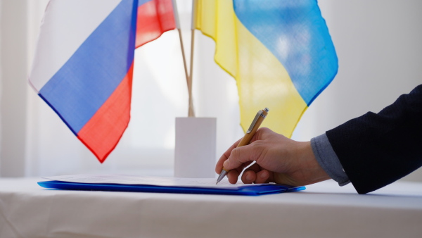 Signing a document between Russia and Ukraine, close-up.