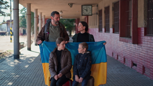 An Ukrainian refugee family in station waiting to leave Ukraine due to the Russian invasion of Ukraine.