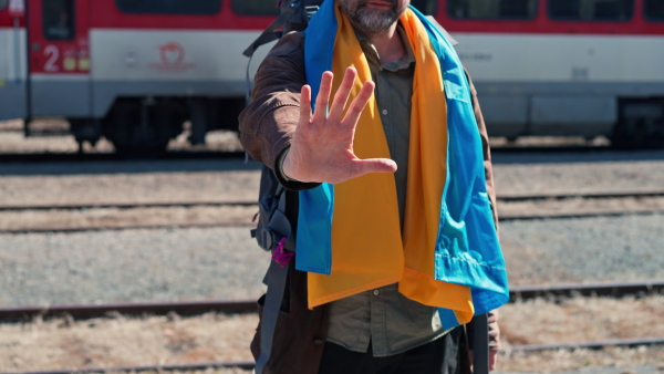 A man saying goodbye to his family leaving Ukraine due to war.