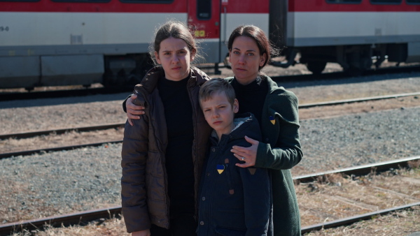 An Ukrainian refugee family in station waiting to leave Ukraine due to the Russian invasion of Ukraine.