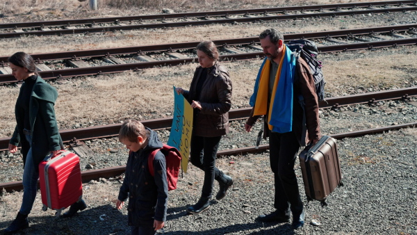 An Ukrainian refugee family in station waiting to leave Ukraine due to the Russian invasion of Ukraine.