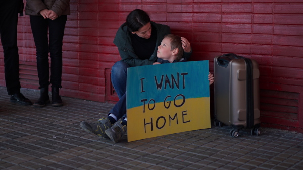 An Ukrainian refugee family in station waiting to leave Ukraine due to the Russian invasion of Ukraine.