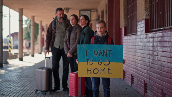 An Ukrainian refugee family in station waiting to leave Ukraine due to the Russian invasion of Ukraine.