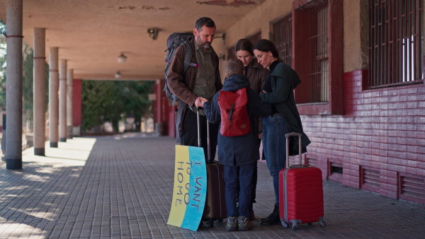 An Ukrainian refugee family in station waiting to leave Ukraine due to the Russian invasion of Ukraine.