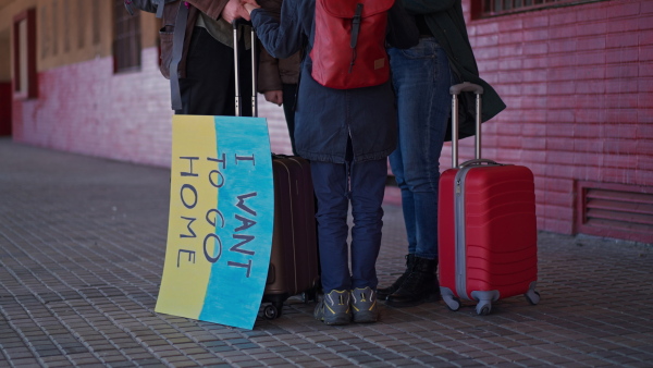 An Ukrainian refugee family in station waiting to leave Ukraine due to the Russian invasion of Ukraine.