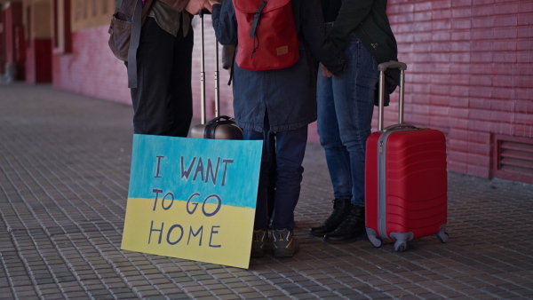 An Ukrainian refugee family in station waiting to leave Ukraine due to the Russian invasion of Ukraine.