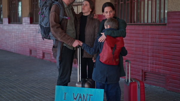 An Ukrainian refugee family in station waiting to leave Ukraine due to the Russian invasion of Ukraine.