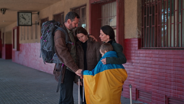 An Ukrainian refugee family in station waiting to leave Ukraine due to the Russian invasion of Ukraine.