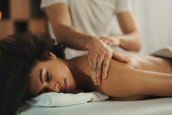 Young woman having relaxing back massage at the spa.