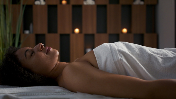 Young woman having relaxing head massage at the spa.