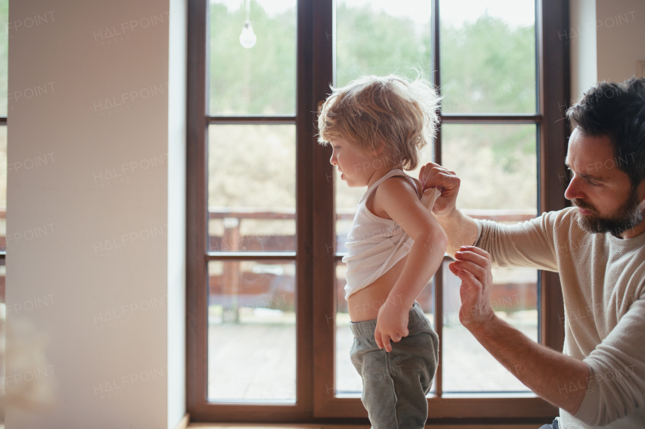 Father is checking his son's skin, looking for rashes or skin reactions