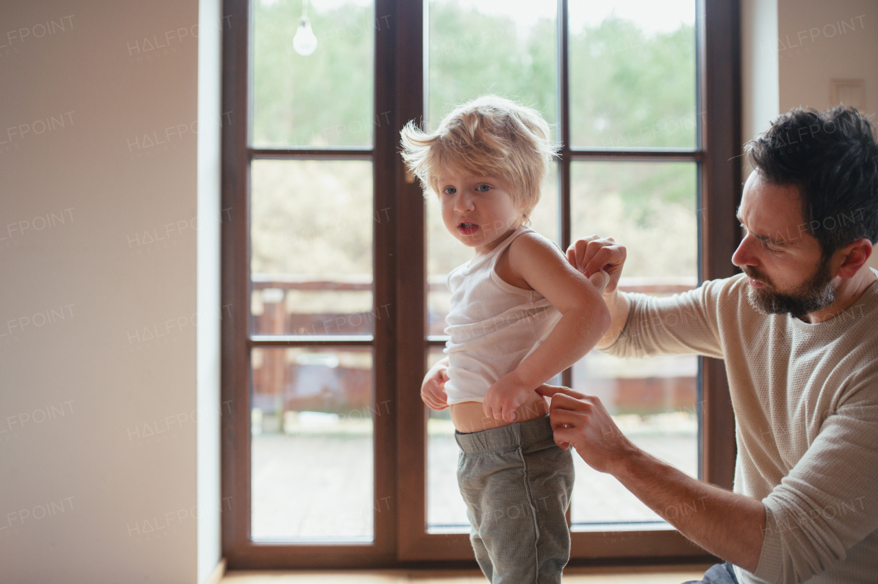 Father is checking his son's skin, looking for rashes or skin reactions