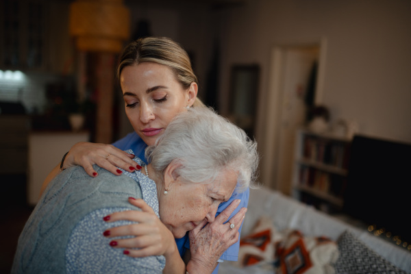 Psychologist provides mental health support and grief counseling to female elderly patient.