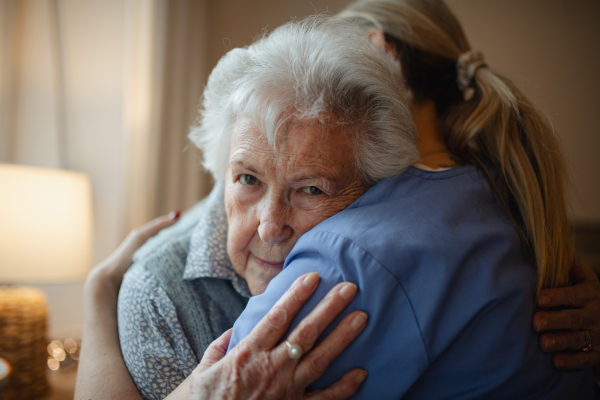 Psychologist provides mental health support and grief counseling to female elderly patient.