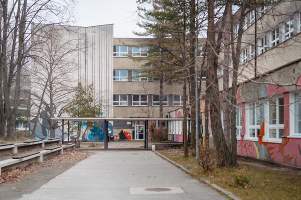 View of the exterior of a high school on a cold spring day.