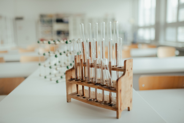 Laboratory test tube kit in wooden stand. Science or chemistry lab, classroom.