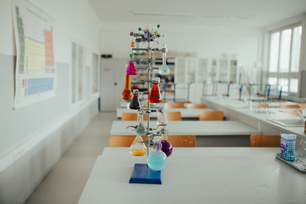 Science lab or specialized classroom for chemistry, biology or physic in school. Laboratory glassware on table.