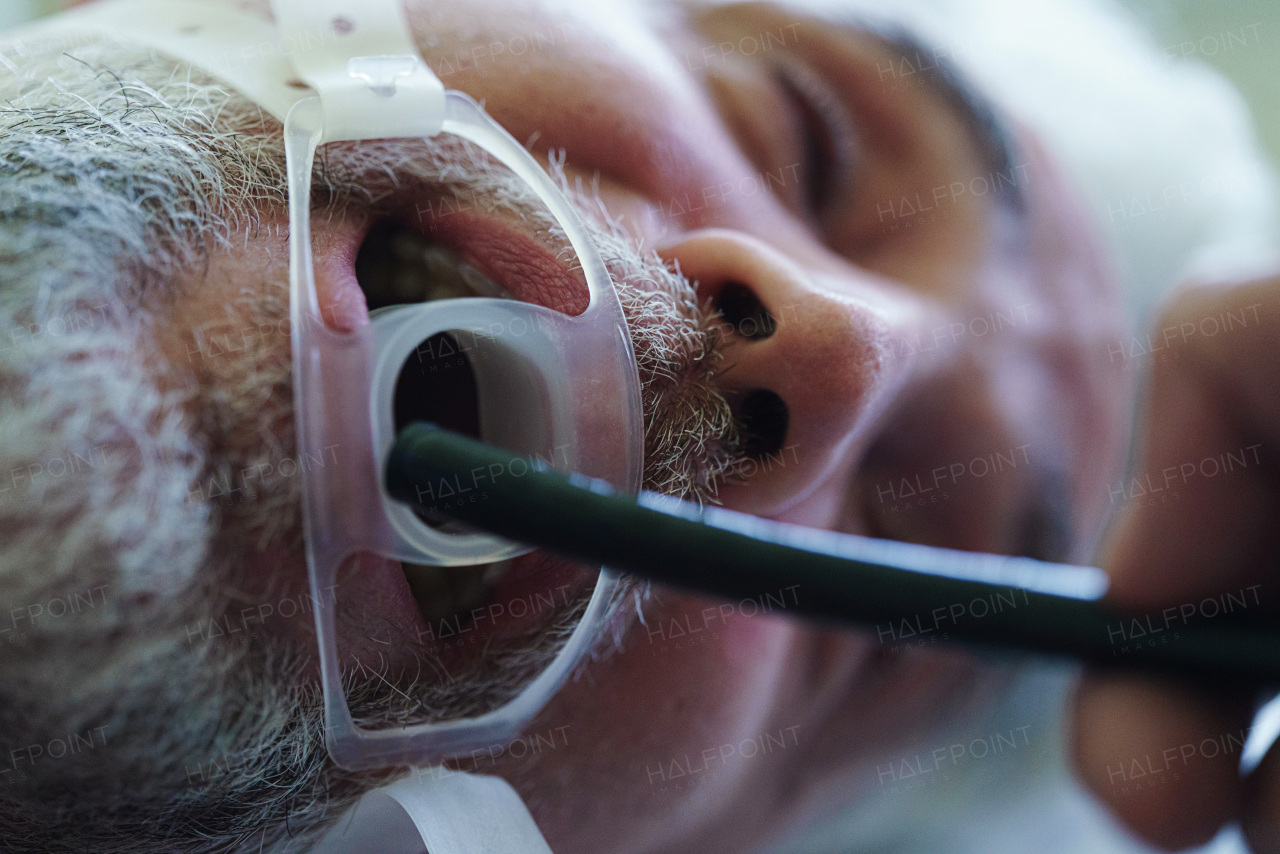 Close up of gastroscopy procedure on sedated patient to examine upper digestive tract. Medical procedure.