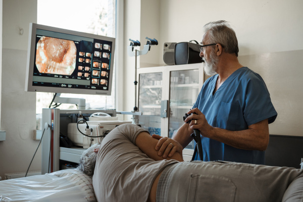 Gastroscopy procedure on sedated patient to examine upper digestive tract. Medical procedure.