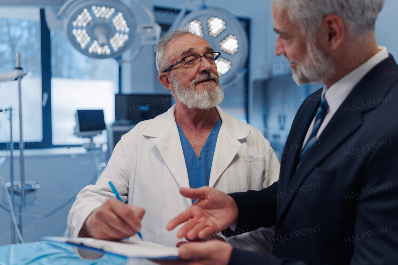 Doctor signing contract with pharmaceutical representative, successful deal.