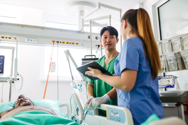Medical team providing emergency care to critical patient in hospital.