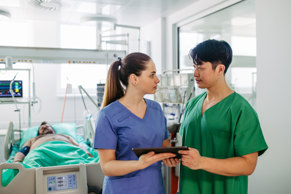 Medical team providing emergency care to critical patient in hospital.