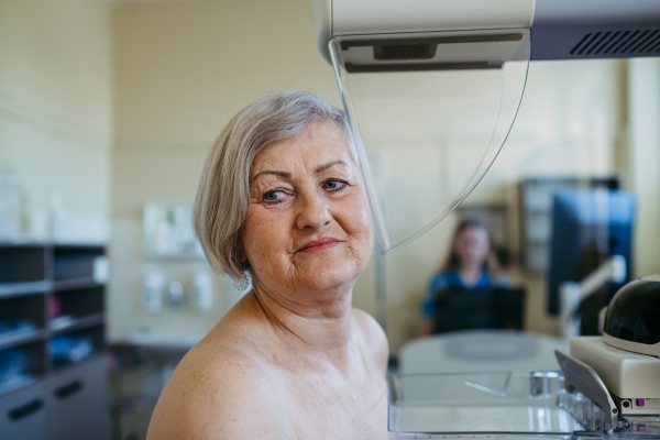 Older woman having yearly mammography for preventive healthcare