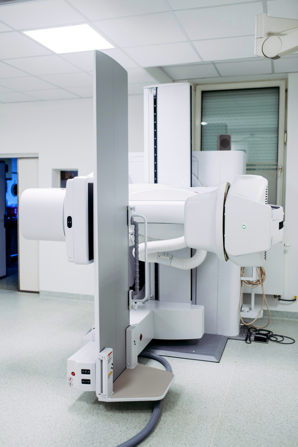 Modern tilting fluoroscopy wall unit in diagnostic imaging room