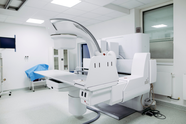 Modern tilting fluoroscopy wall unit in diagnostic imaging room
