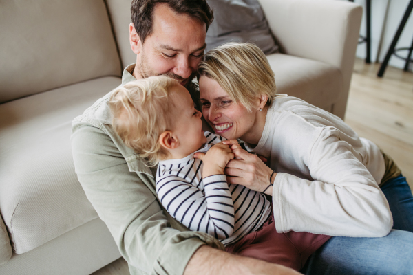 Happy family playing together at home. Bonding moment.