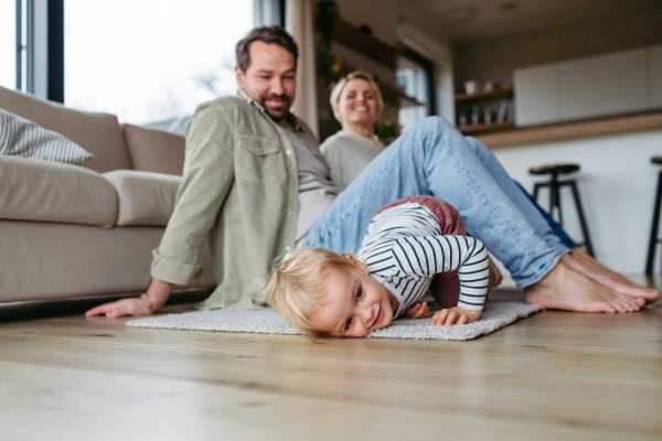 Happy family playing together at home. Bonding moment.