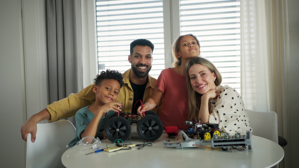 A video of parents with children exploring robotics and technical skills.