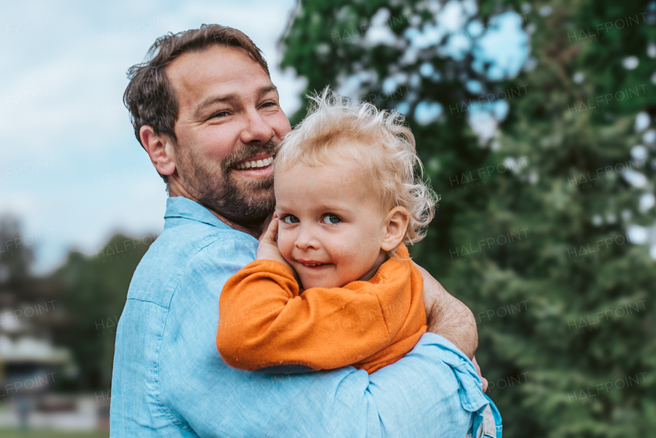 Portrait of dad and child enjoying time together. Fathers day concept.